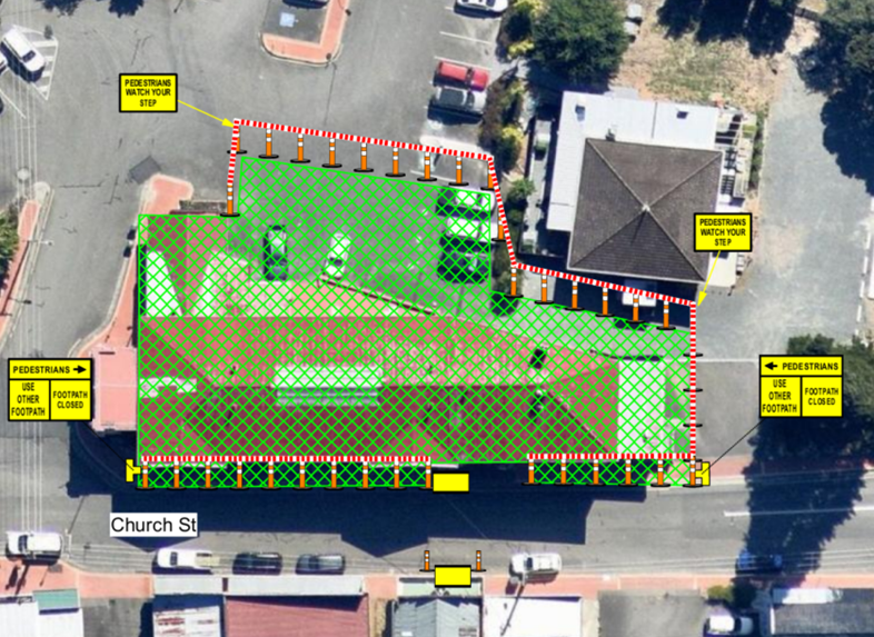 Aerial view of a construction site with a green overlay and red crosshatch pattern. Signs indicate pedestrian footpath closures on Church St. Cones and barriers outline the site, and vehicles are visible inside the area.